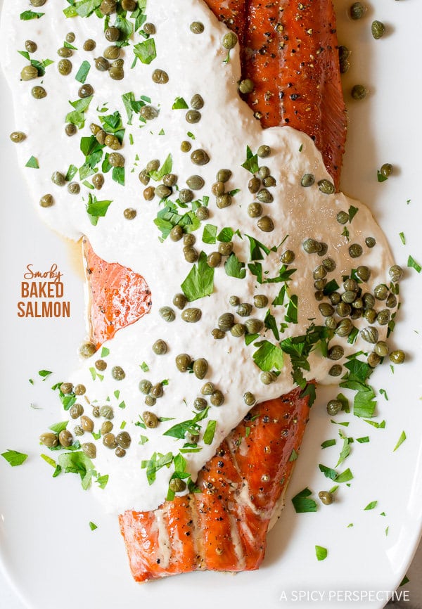 Baked salmon covered in horseradish sauce, capers and herbs. 