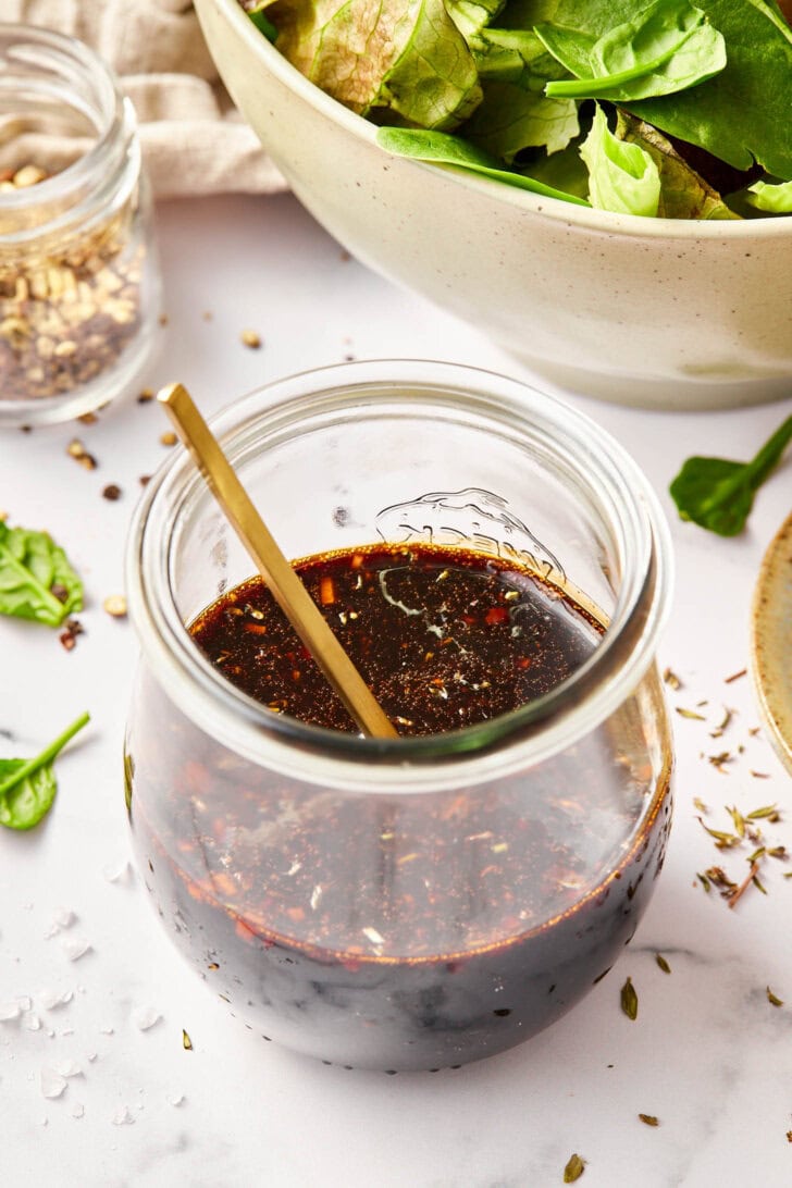 Balsamic Dressing Recipe - Homemade balsamic salad dressing in jar with spoon.