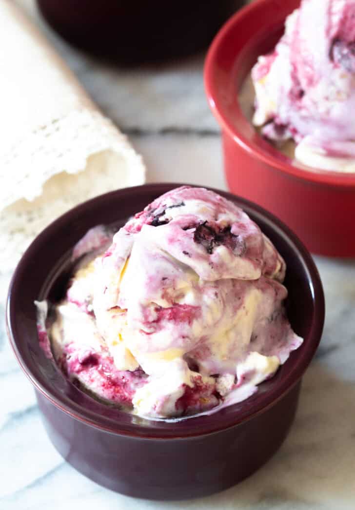 Dark bowl with blueberry pie ice cream.