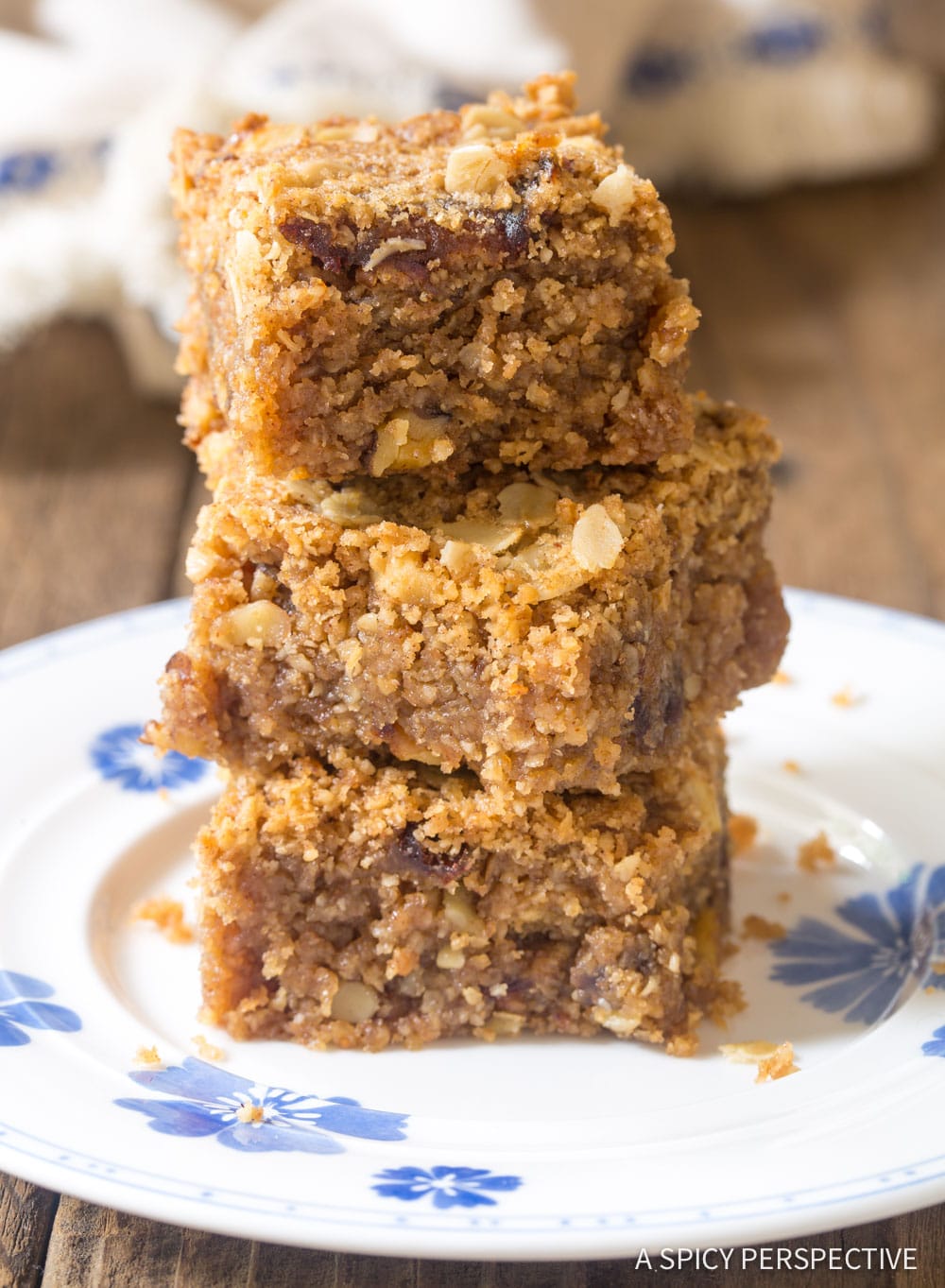 Soft sweet oat breakfast bars stacked on top of each other.
