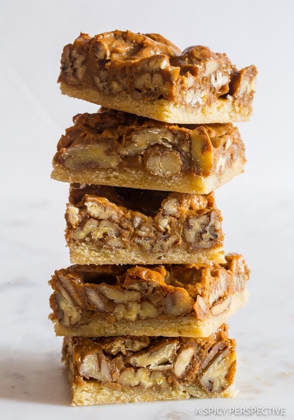 Pecan Pie bars stacked on top of each other. 