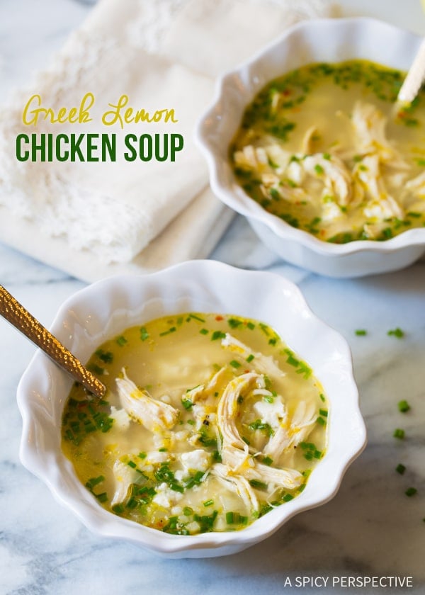 Two bowls of Greek lemon chicken soup recipe on counter. 