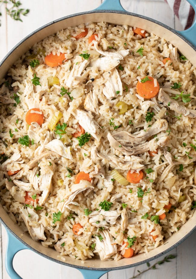 Chicken and rice in a large Dutch oven pot. 