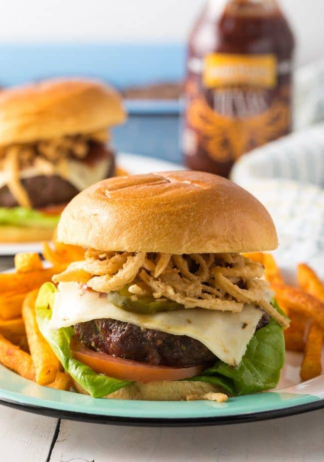 Spicy Cowboy Bacon Burgers Recipe on plate with fries 